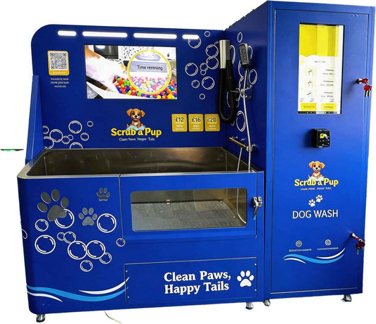 Blue self-service dog wash machine with touchscreen, payment options, and 'Scrub a Pup' branding for clean paws and happy tails.