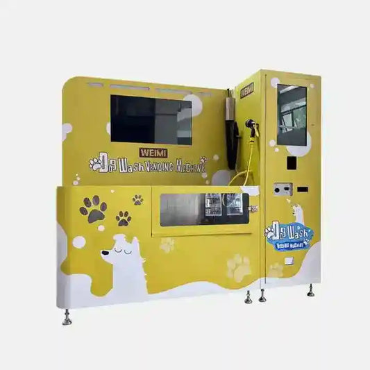Yellow self-service dog wash vending machine with paw prints, touchscreen, and spray hose for pet grooming